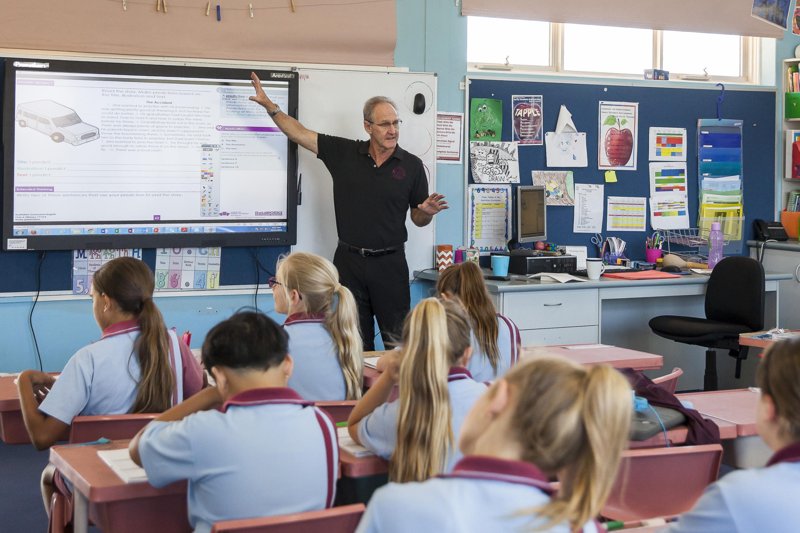 A teacher exemplifying one of the 10 essential classroom management skills as her class is focused and organised.