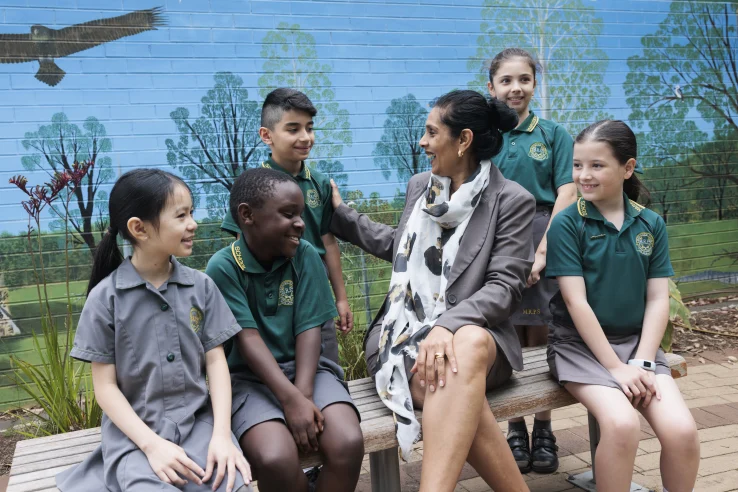 A teacher exemplifying one of the 10 essential classroom management skills as her class is focused and organised.