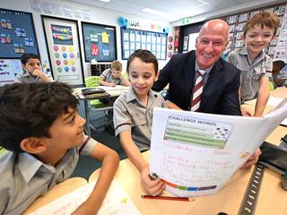 A teacher exemplifying one of the 10 essential classroom management skills as her class is focused and organised.