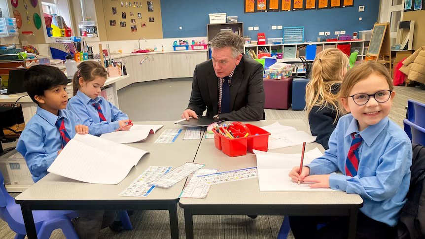 A teacher exemplifying one of the 10 essential classroom management skills as her class is focused and organised.