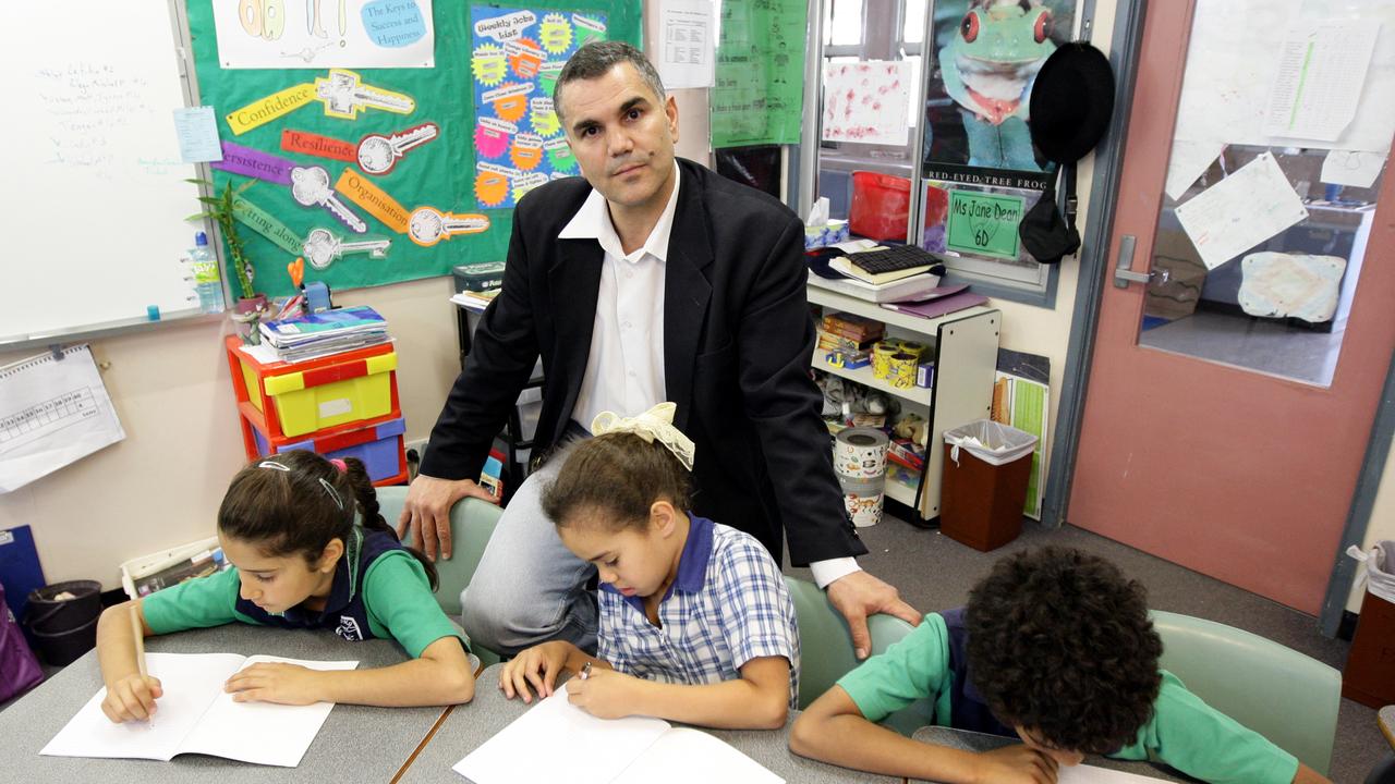 A teacher exemplifying one of the 10 essential classroom management skills as her class is focused and organised.