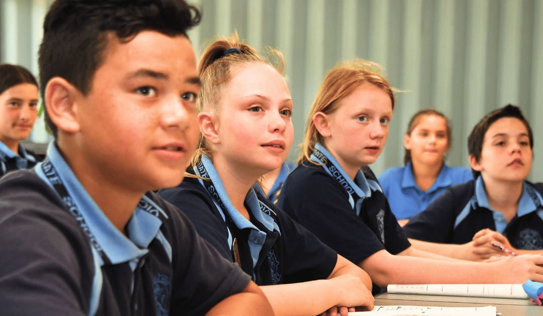 image of students listening to the teacher
