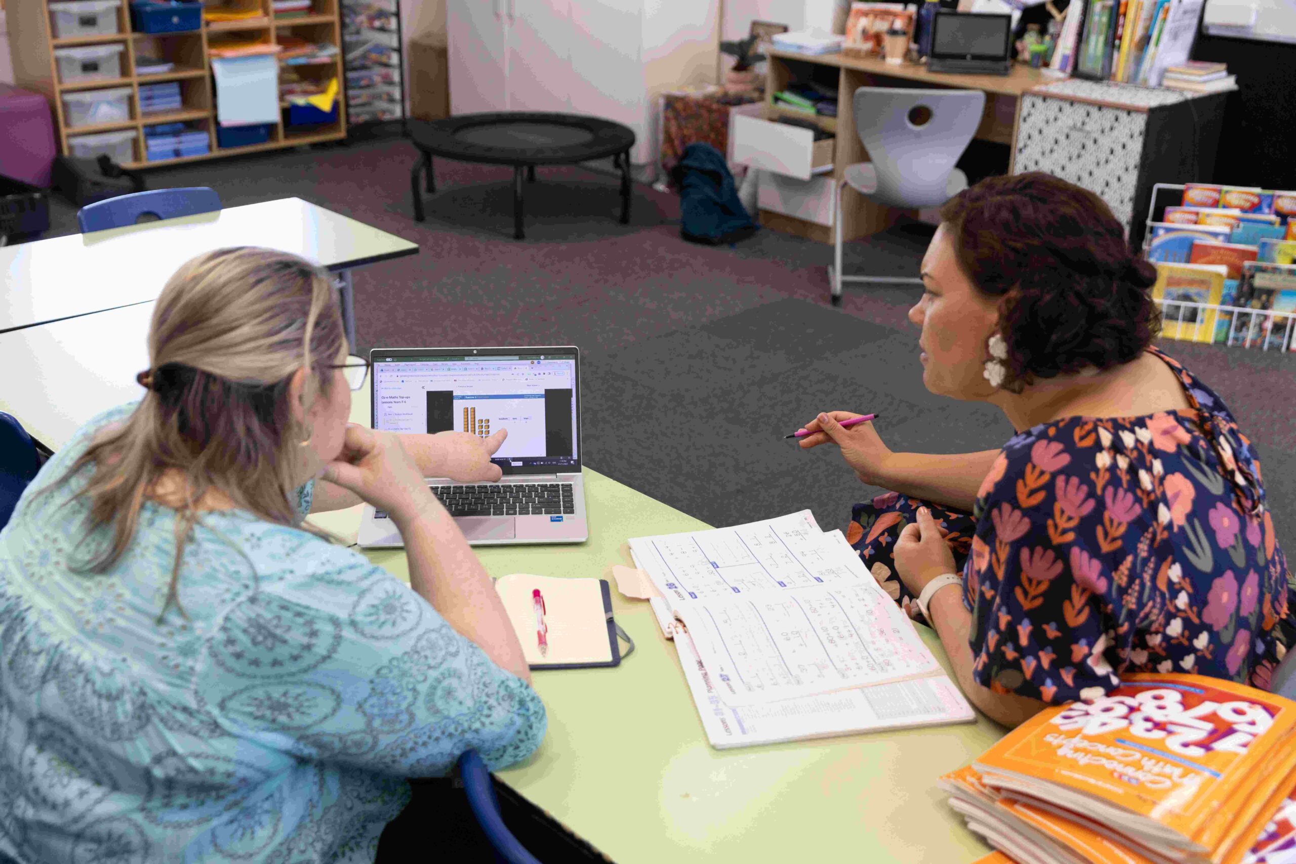 Teacher talking to a principal.