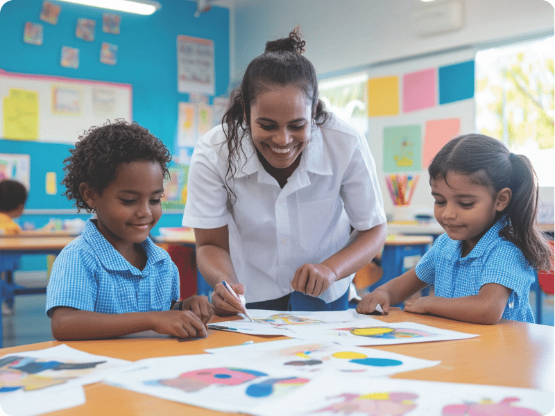 Teacher helping two students