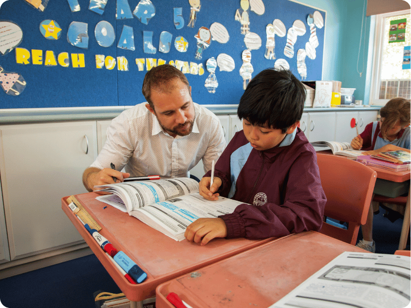 Experienced teacher supporting a student